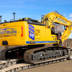 Gul gravemaskin fra Beitostølen Maskin og Transport A/S